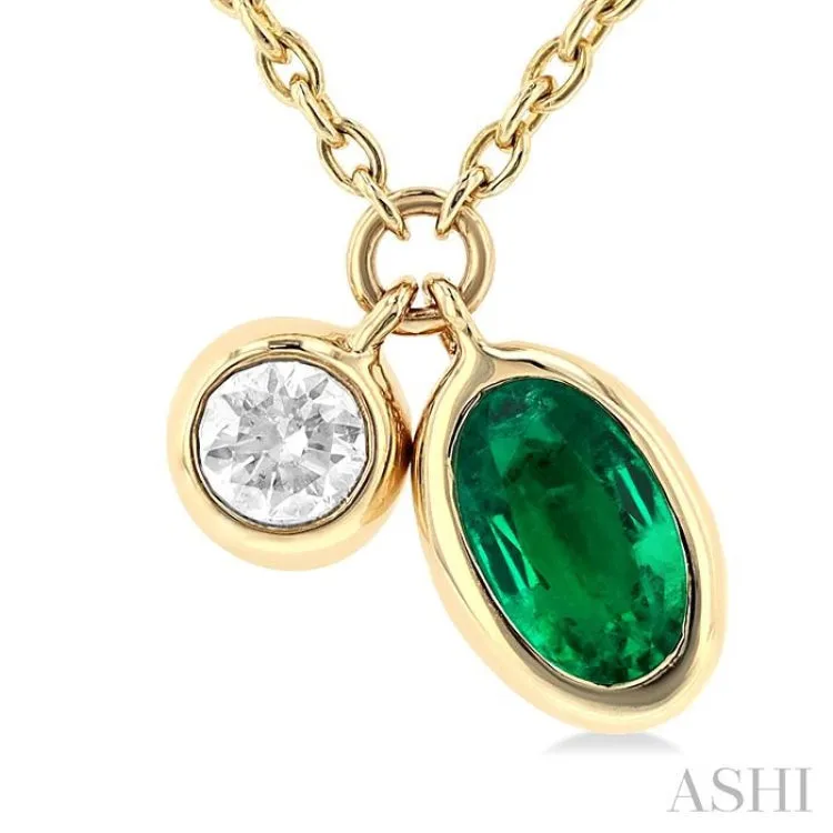 1/50 ctw Oval Cut 6X4MM Emerald and Bezel Set Round Cut Diamond Precious Necklace in 10K Yellow Gold