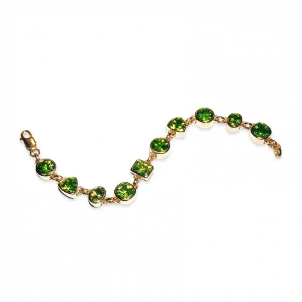 Yellow gold bracelet with bezel set peridot in multiple shapes